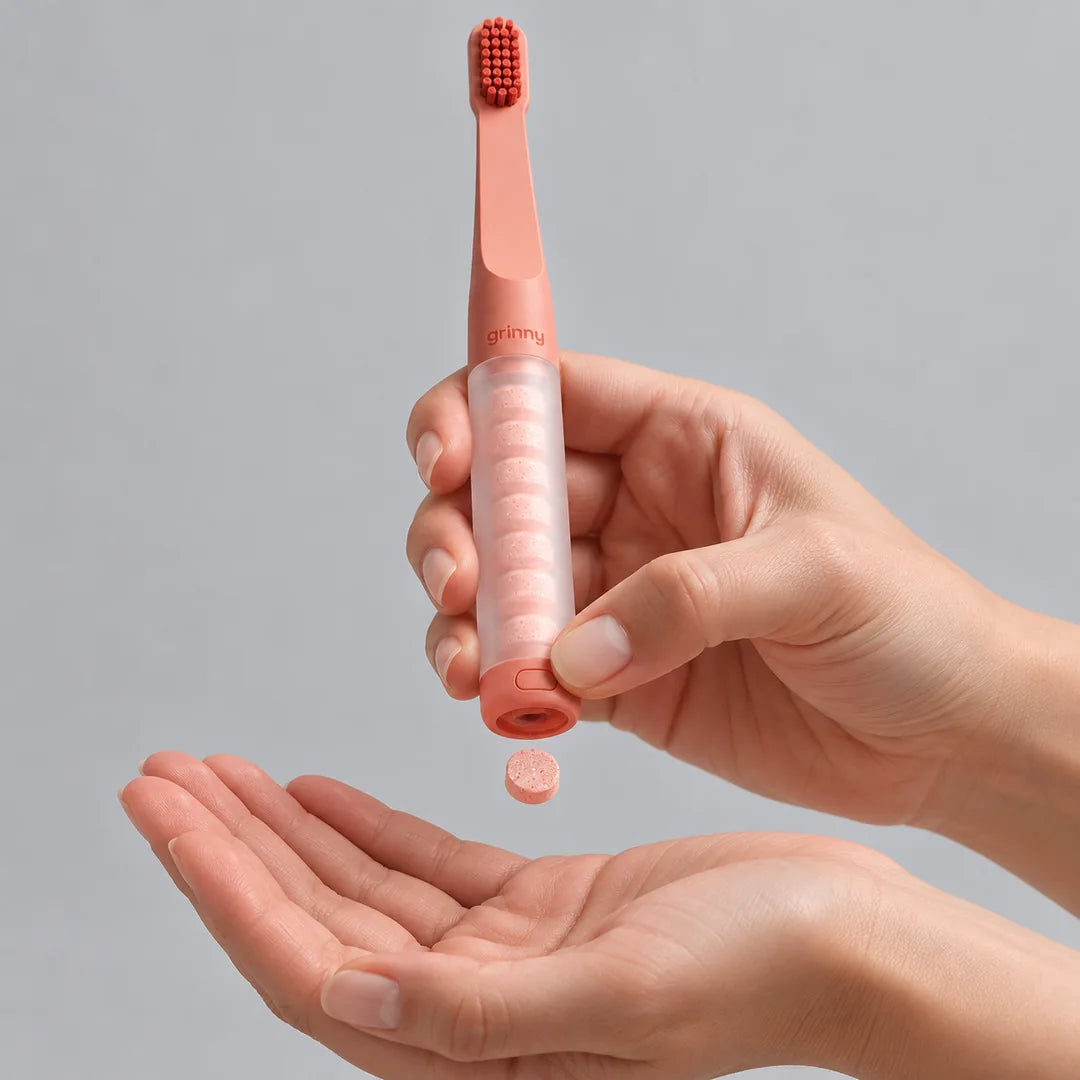 Tablet Brush bottom dispenser releases one tablet into the palm